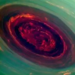 这是美国宇航局卡西尼探测器拍摄的土星北极风暴图像,遨游太空时代周刊2013最佳太空照片套图第16张